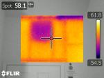 Infrared over digital image of missing wall insulation